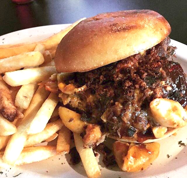 The Pinnacle- Carnitas-style pulled pork, Ancho-BBQ, house mac & cheese, crispy prosciutto, garlic butter roll.
